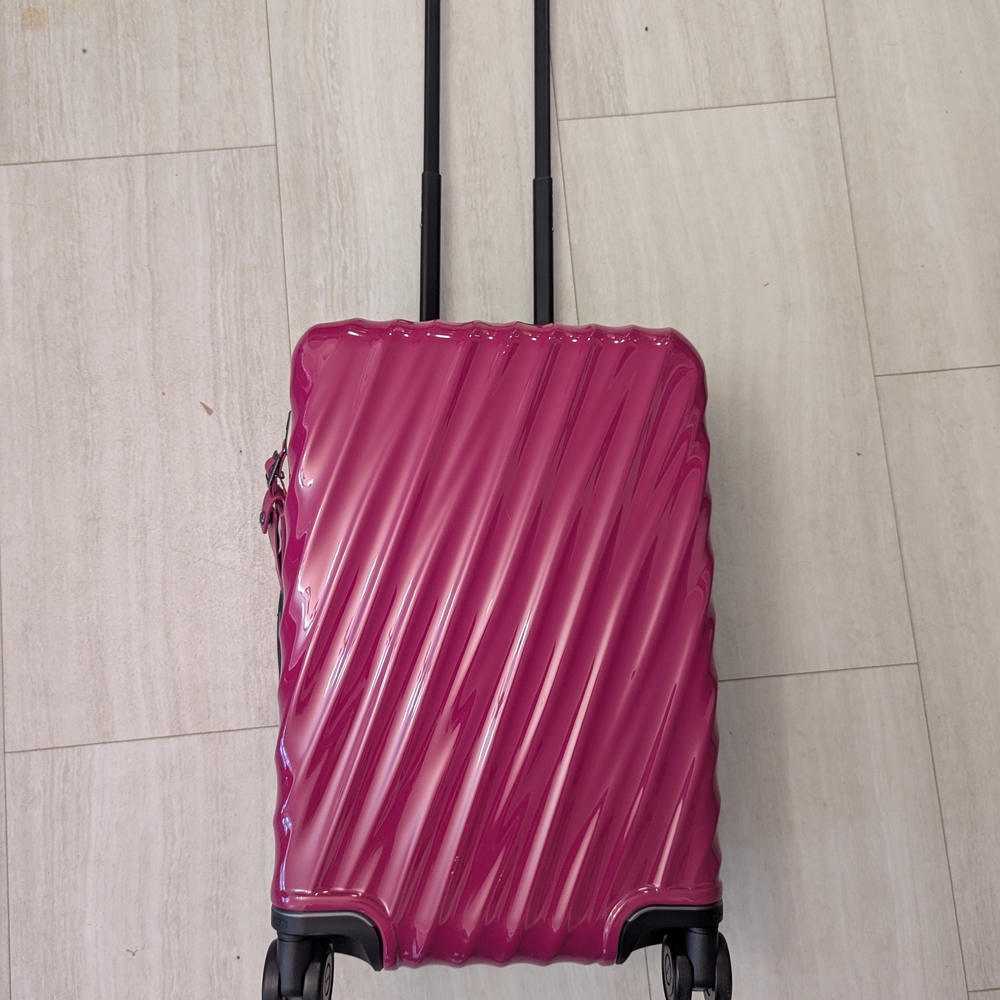 Tumi Magenta Rolling Luggage